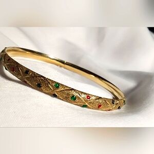 Vintage lady's 14k Bangle with 55 gems sit flush with with this diamond cut
